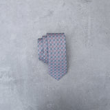 Lovewell silk tie designed by Niki Fulton. Pale pink & duck egg blue graphical print.