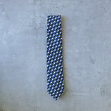 Eclipse silk tie designed by Niki Fulton. A blue & grey graphical print.