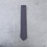 Kiss Kiss silk tie designed by Niki Fulton. A graphical print in deep purple. 