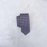 Kiss Kiss silk tie designed by Niki Fulton. A graphical print in deep purple. 