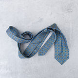 Lovewell Khaki silk tie designed by Niki Fulton. A teal & khaki print.