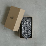 Eden linen tie designed by Niki Fulton. A black & white abstract print. 