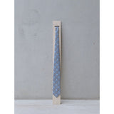 Breton Signal silk tie on a plinth