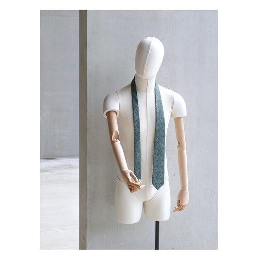 Fennel Tangle Tie designed by Niki Fulton. A green floral print. Seen here on a mannequin
