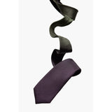 Rock silk tie designed by Niki Fulton. A deep purple to dark green tie.