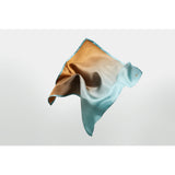 Salt silk pocket square designed by Niki Fulton. A blend of sandy camel to Hebridean sea blue 