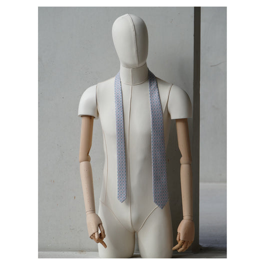 Lovewell Tie designed by Niki Fulton. A pale pink & duck egg blue graphical print. Seen here on a mannequin.