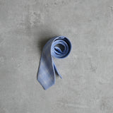 Prufrock blue Linen Tie designed by Niki Fulton. Blue & white abstract print.