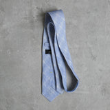 Prufrock blue Linen Tie designed by Niki Fulton. Blue & white abstract print.