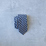 Eclipse silk tie designed by Niki Fulton. A blue & grey graphical print.
